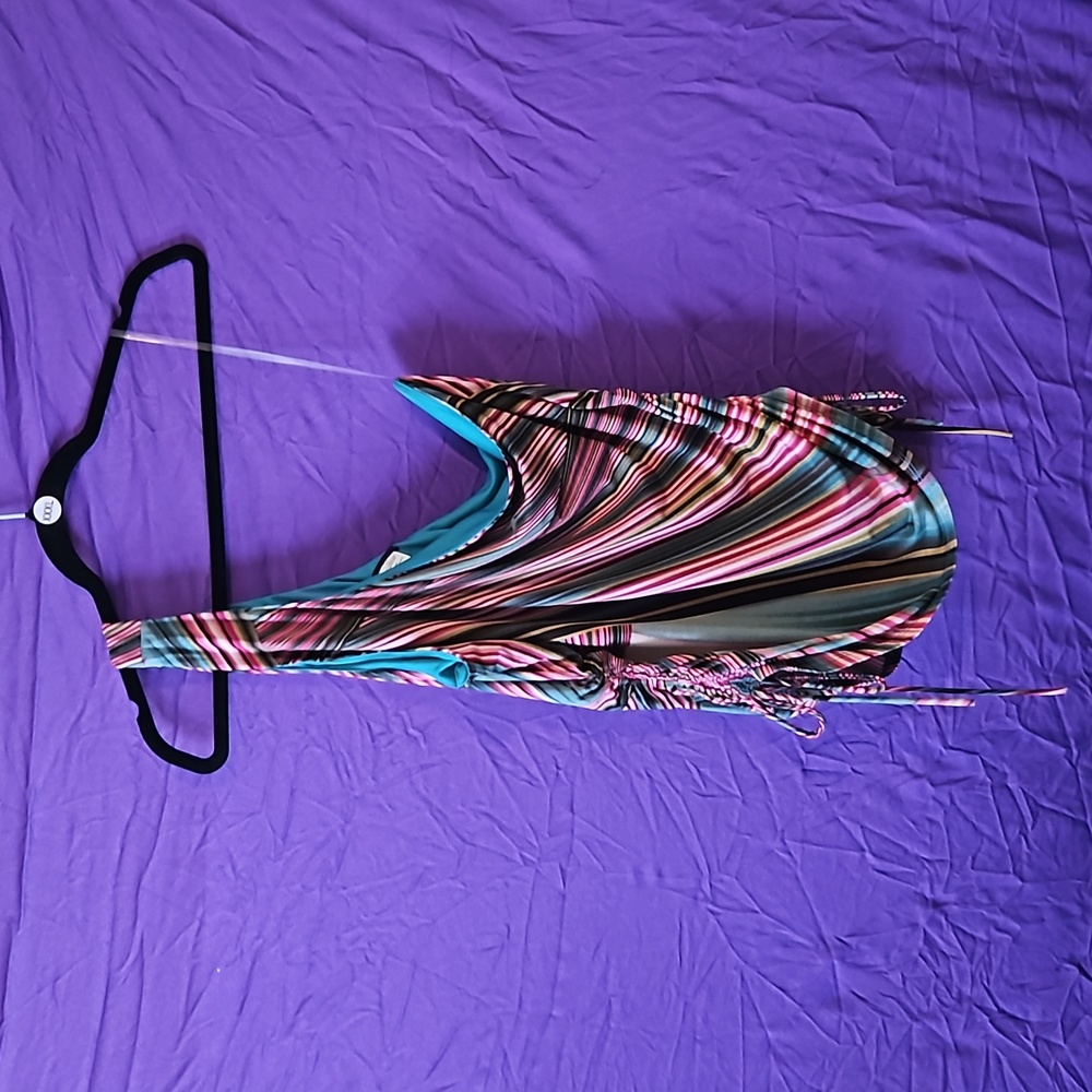 A one shoulder tank top with adjustable side straps